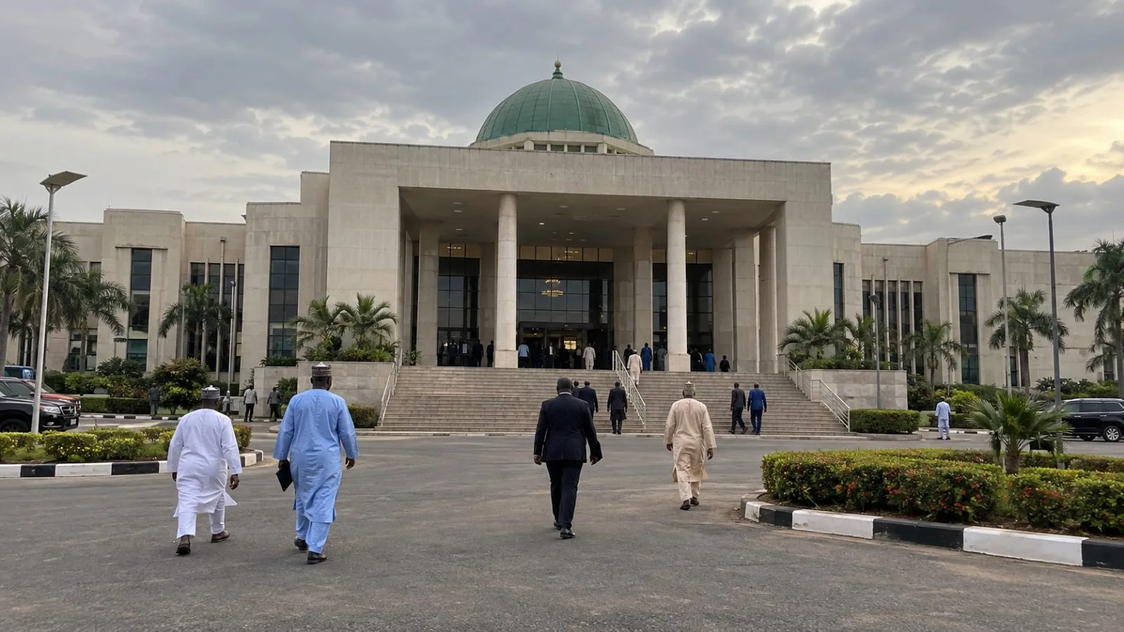 People walk outside the Kwara State House of Assembly in Ilorin, Nigeria. (AI-generated image / EconoTimes)