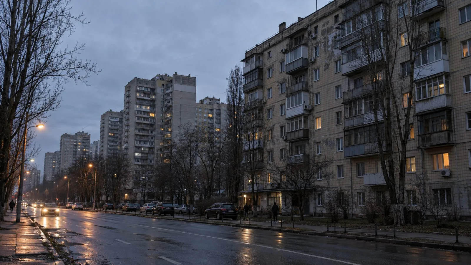 Residents pass dark apartment blocks along a Kyiv street after overnight power cuts (AI-generated image / EconoTimes)