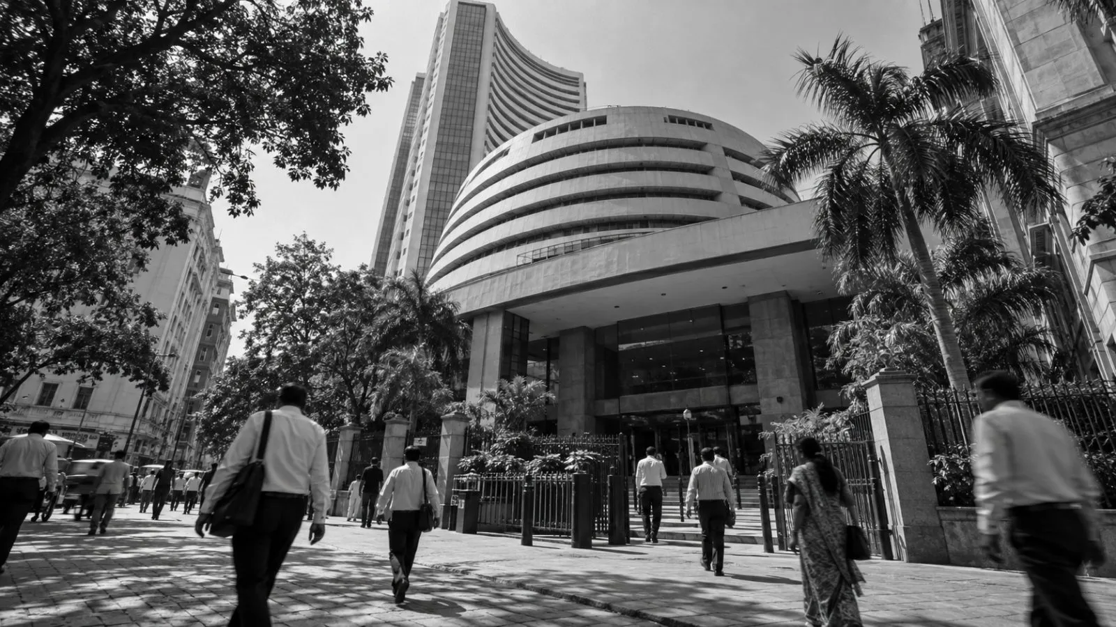 Pedestrians pass the Bombay Stock Exchange building on Dalal Street in Mumbai. (AI-generated image / EconoTimes)