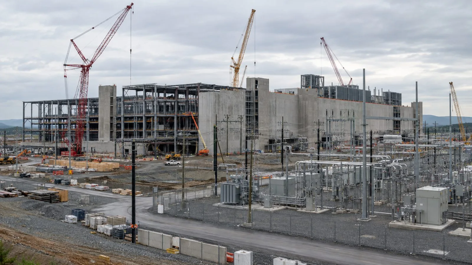 Cranes rise above a data-center construction site in Ashburn, Virginia. (AI-generated image / EconoTimes)