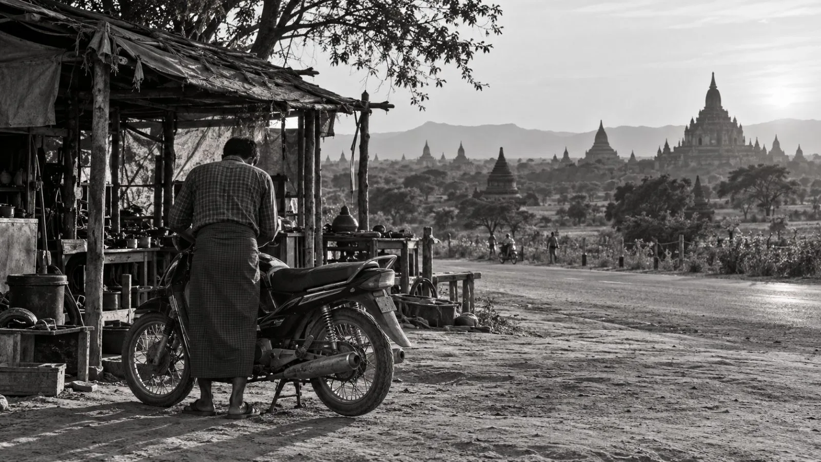 A person checks a motorcycle at a roadside stall in Bagan, Myanmar. (AI-generated image / EconoTimes)