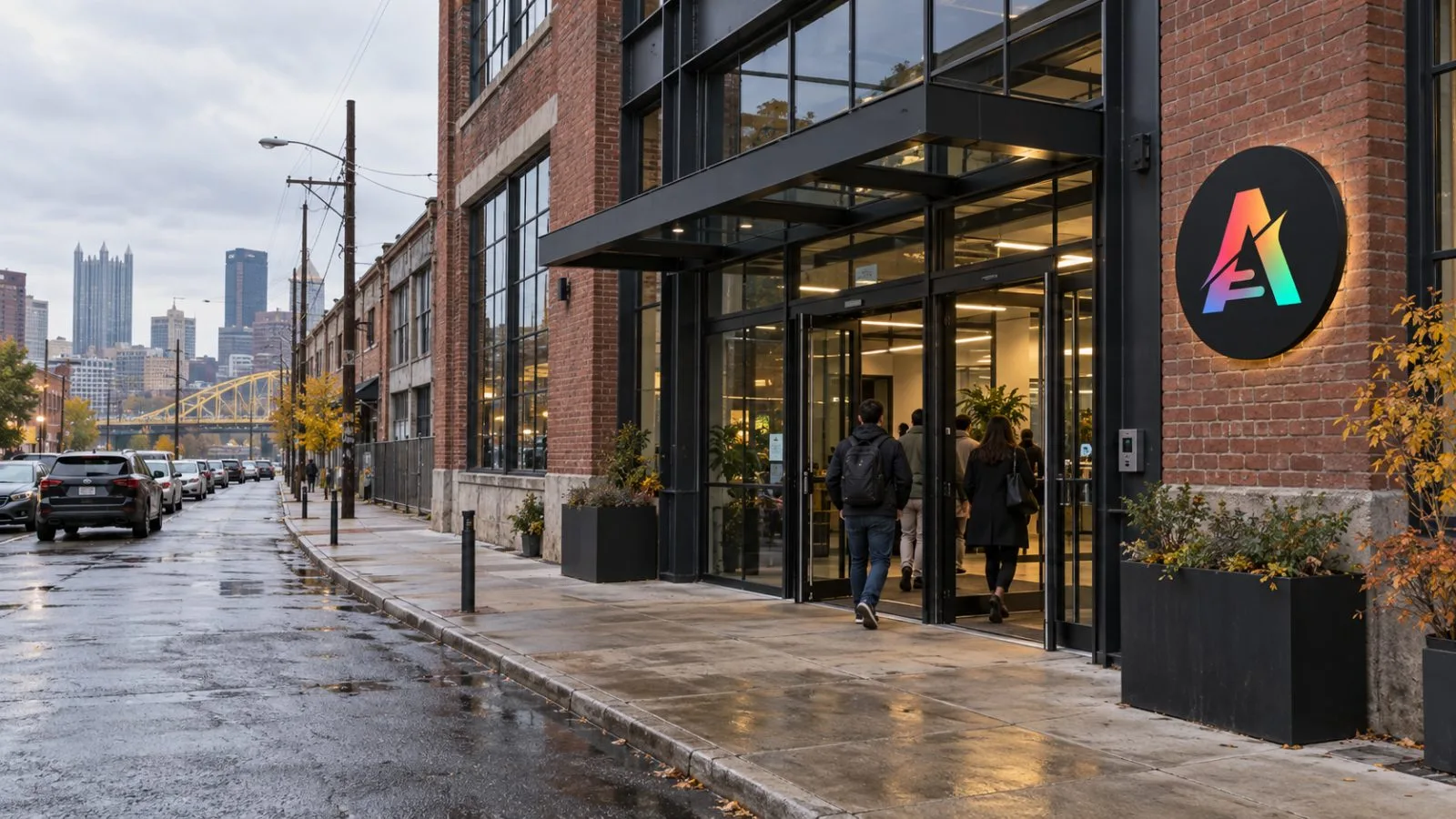 People enter a modern office building in Pittsburgh’s Strip District. / EconoTimes.ai