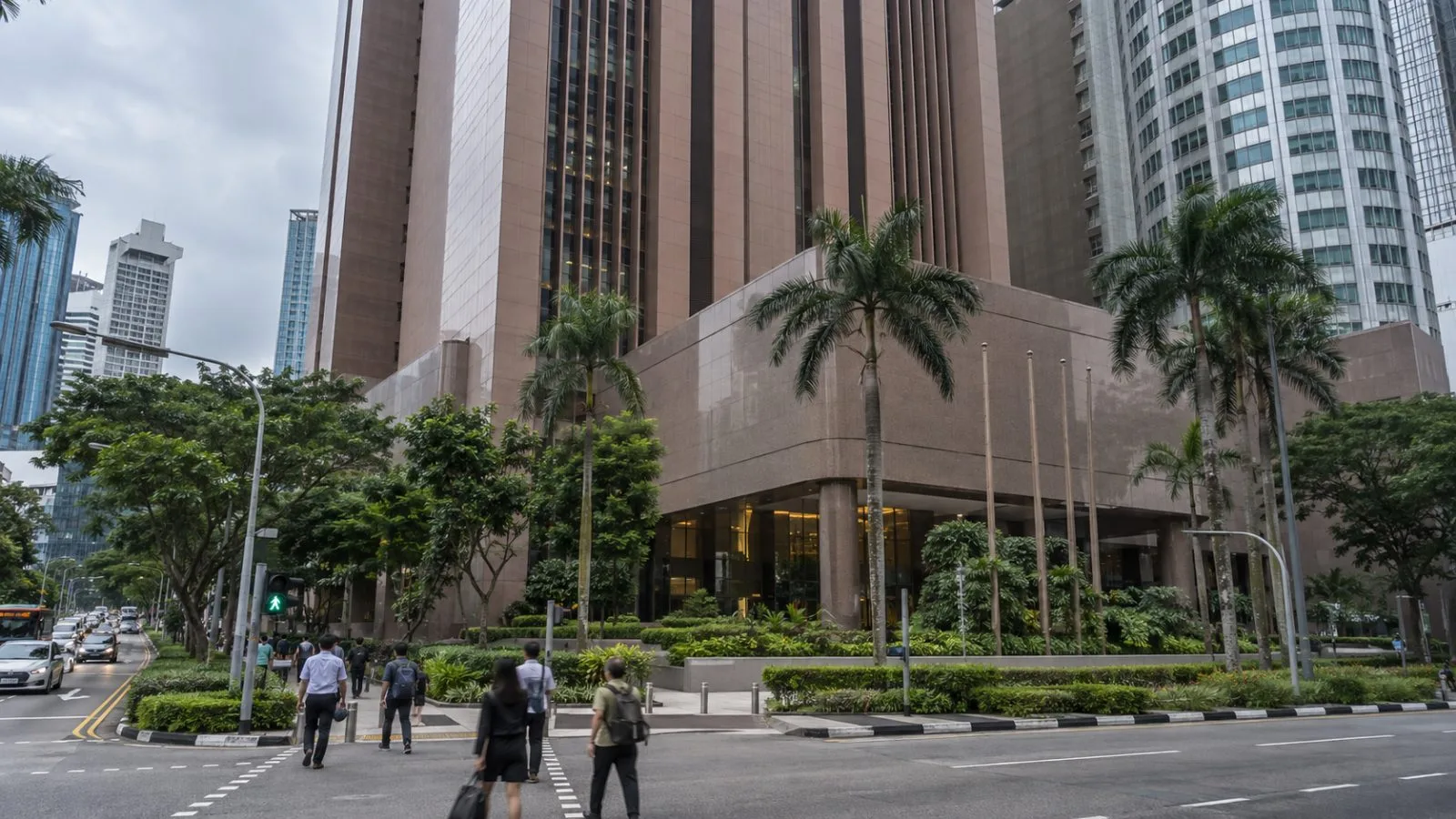 Pedestrians pass the Monetary Authority of Singapore building on an overcast afternoon. (AI-generated image / EconoTimes)