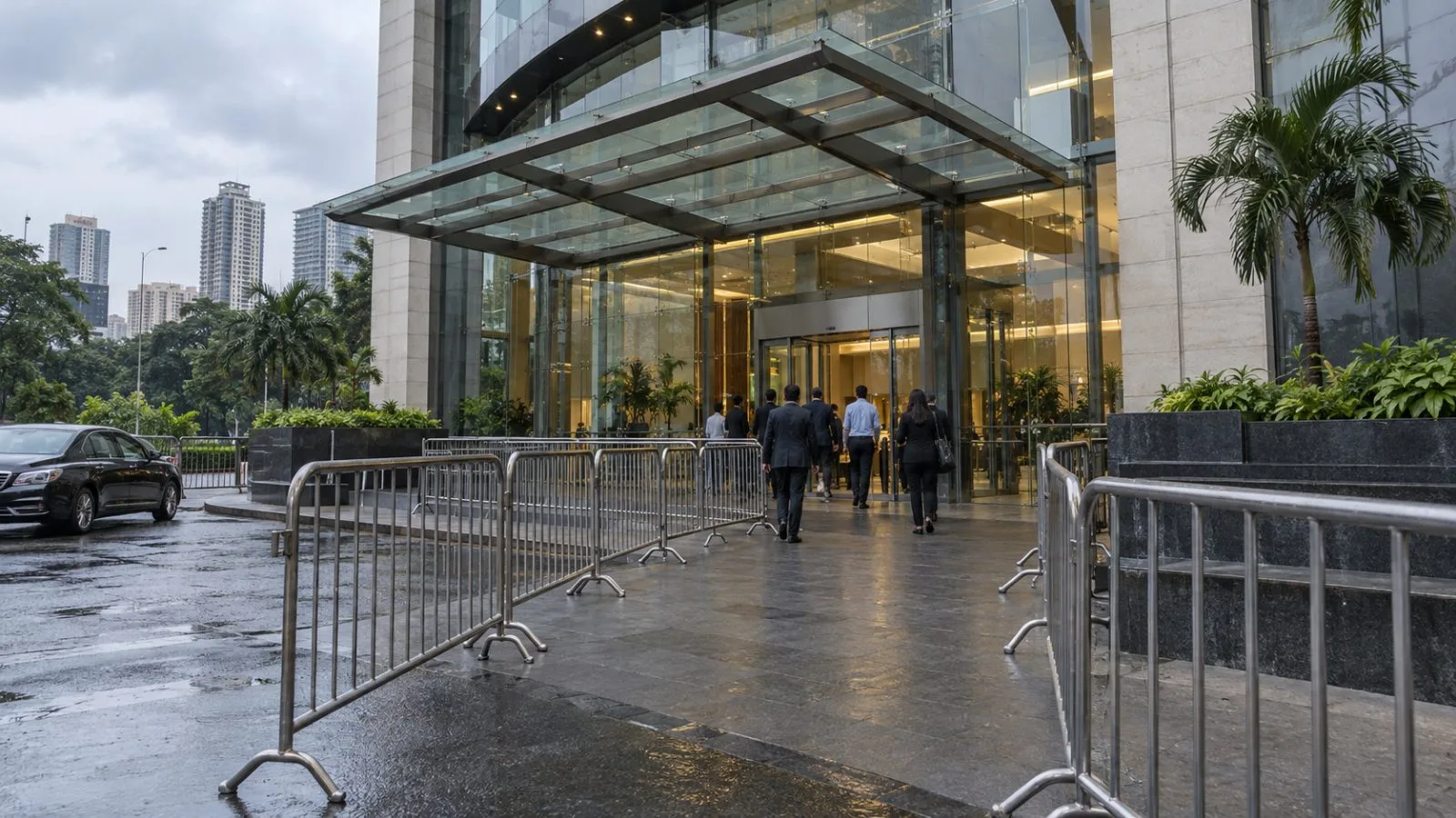 Security barriers line a conference venue in Mumbai, India, beneath an overcast afternoon sky. (AI-generated image / EconoTimes)