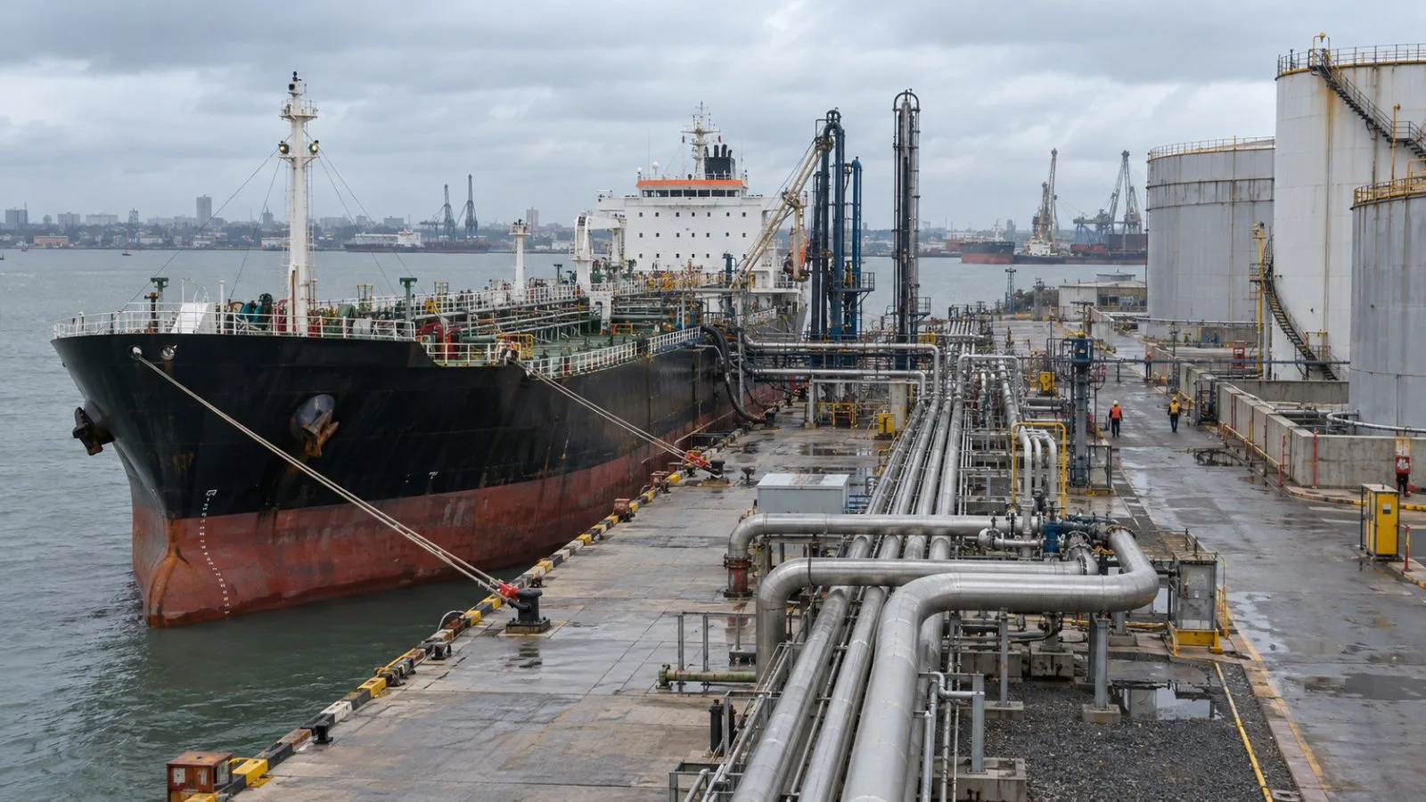 Fuel storage tanks and transfer pipes stand at the Port of Matola, Mozambique. (AI-generated image / EconoTimes)
