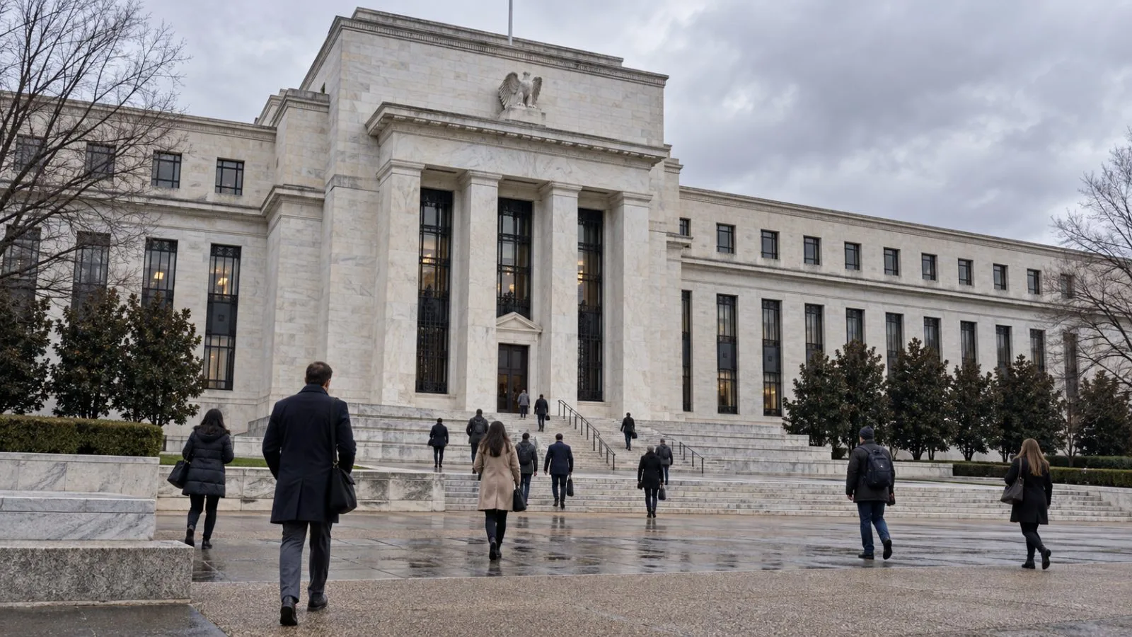 Pedestrians pass the Federal Reserve headquarters in Washington on an overcast morning. / EconoTimes.ai