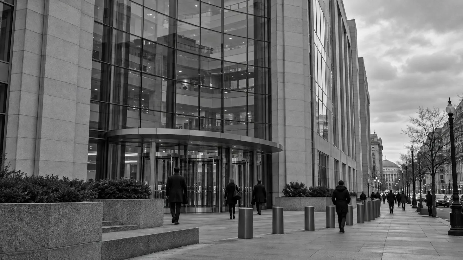 Pedestrians pass the Commodity Futures Trading Commission headquarters in Washington, D.C. / EconoTimes.ai (mono)