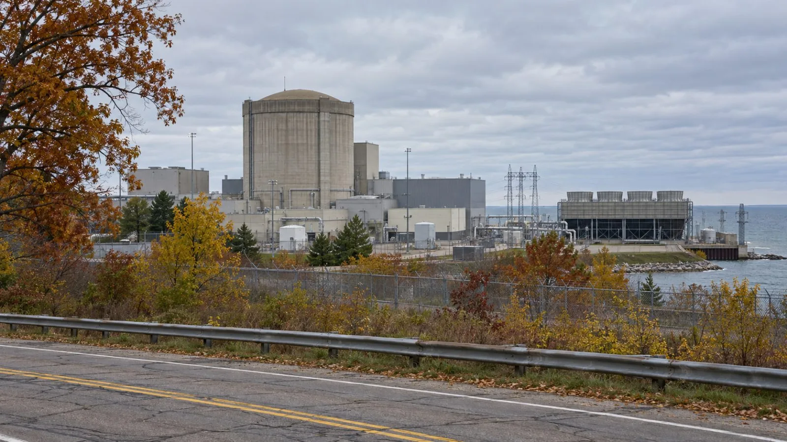 Palisades Nuclear Plant stands behind its security perimeter in Covert Township, Michigan. (AI-generated image / EconoTimes)