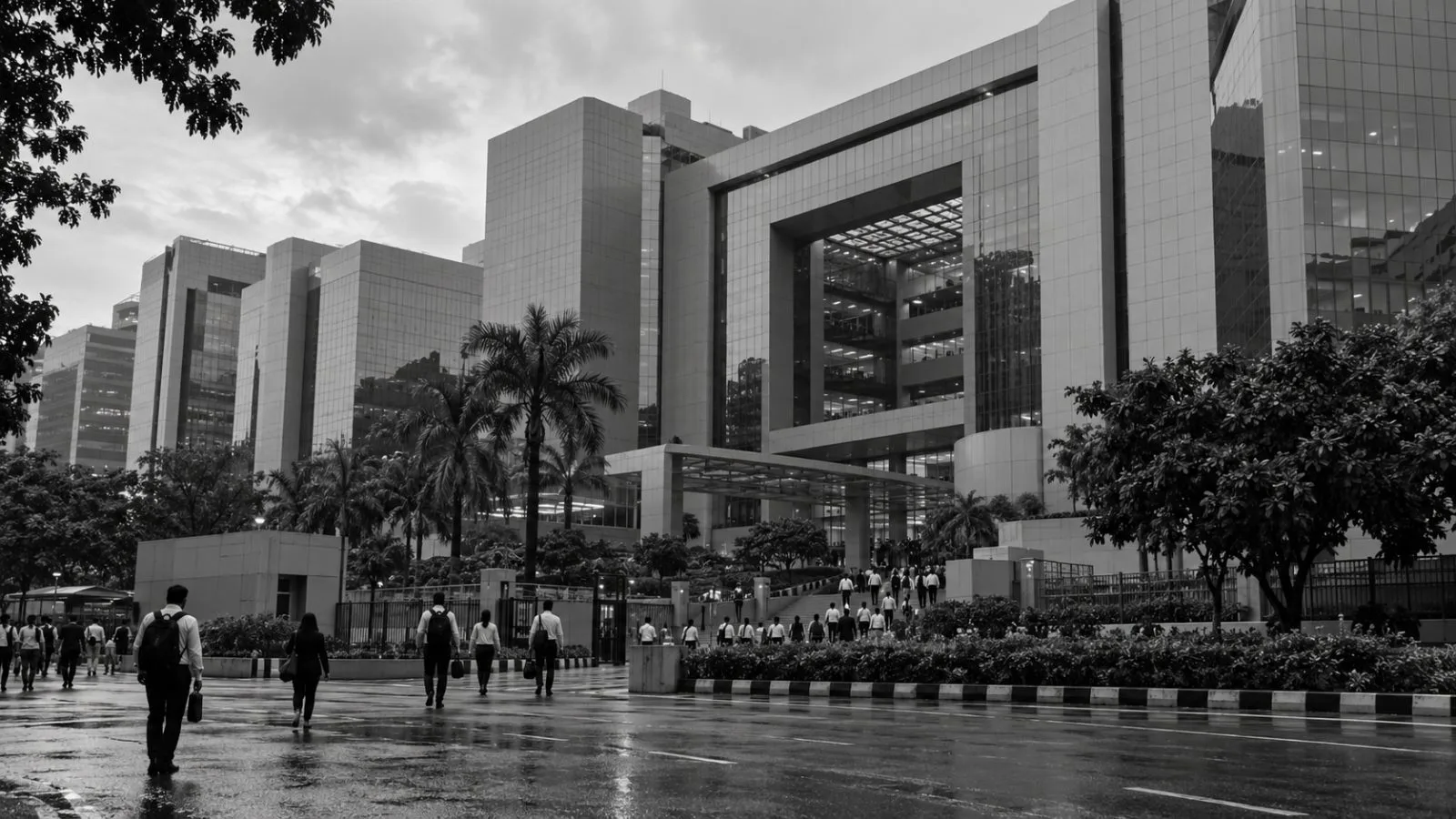 Office workers pass glass office buildings in Mumbai’s Bandra Kurla Complex. (AI-generated image / EconoTimes)