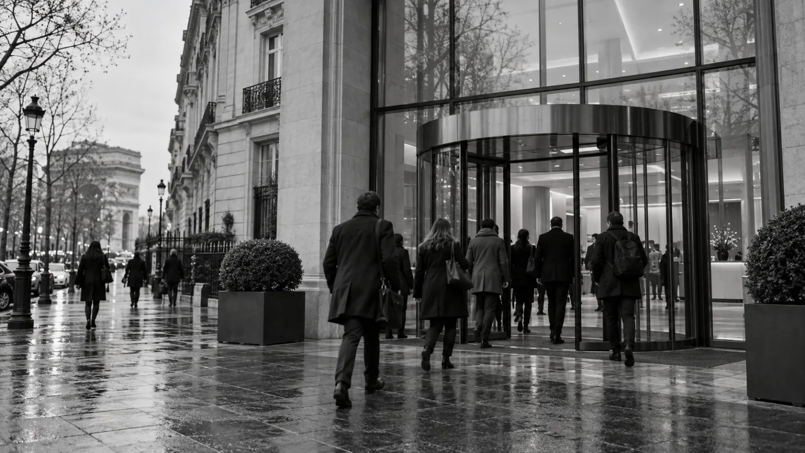 Employees enter an office building on Avenue Kléber in Paris under gray skies. (AI-generated image / EconoTimes)