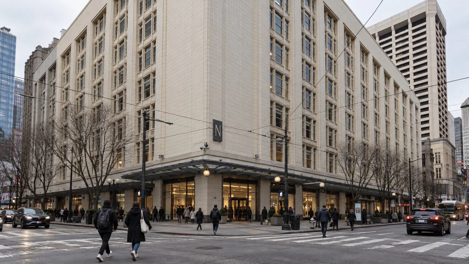 Pedestrians pass the street-level entrance at 2 Stockton Street near Union Square in San Francisco. / EconoTimes.ai