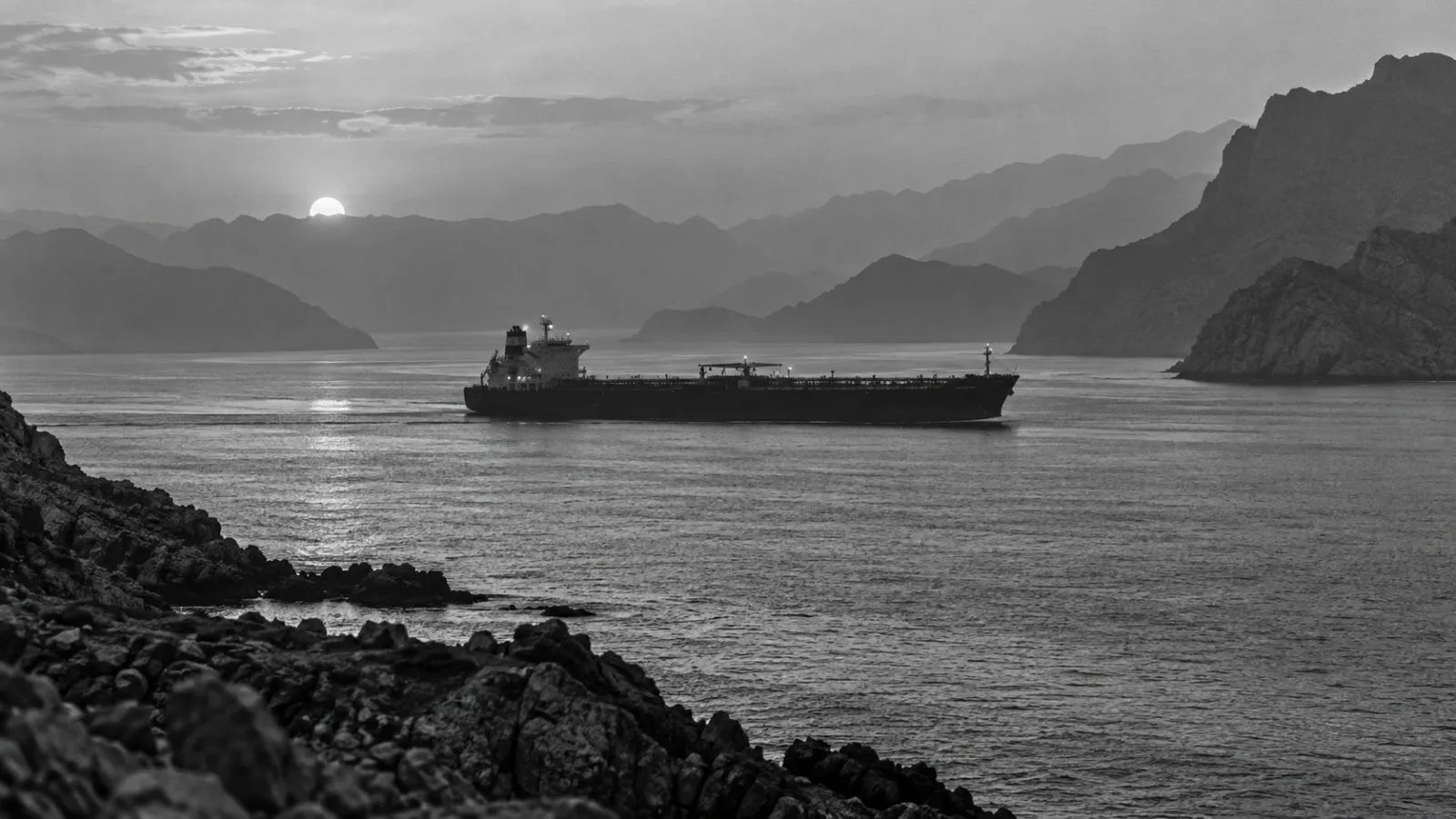 An oil tanker transits the Strait of Hormuz off Khasab, Oman. (AI-generated image / EconoTimes)