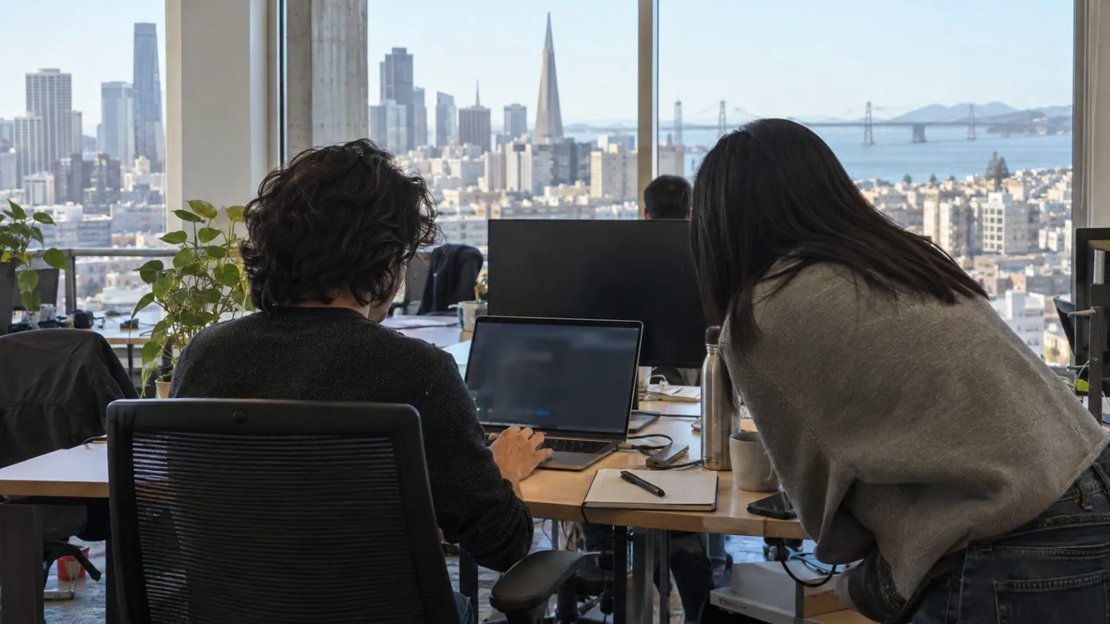 Software engineers review code during a security scan inside a startup office in San Francisco. (AI-generated image / EconoTimes)