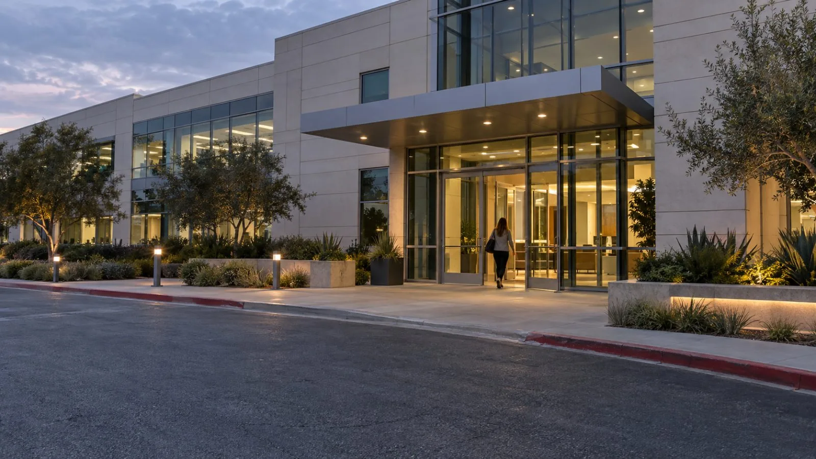 An employee enters MaxLinear’s headquarters in Carlsbad, California, after dusk. (AI-generated image / EconoTimes)