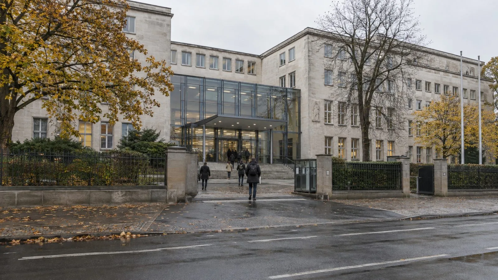 Pedestrians pass the Robert Koch Institute’s exterior in Berlin on an overcast autumn morning. (AI-generated image / EconoTimes)