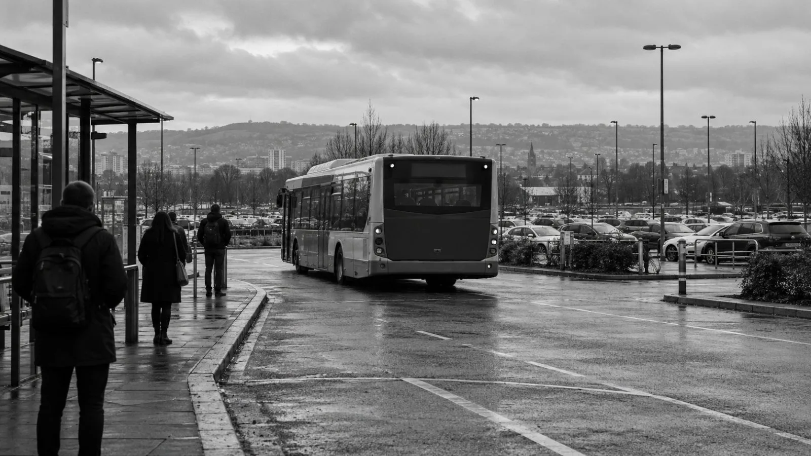 A shuttle bus leaves Cardiff East Park and Ride on an overcast morning in Cardiff, Wales. (AI-generated image / EconoTimes)