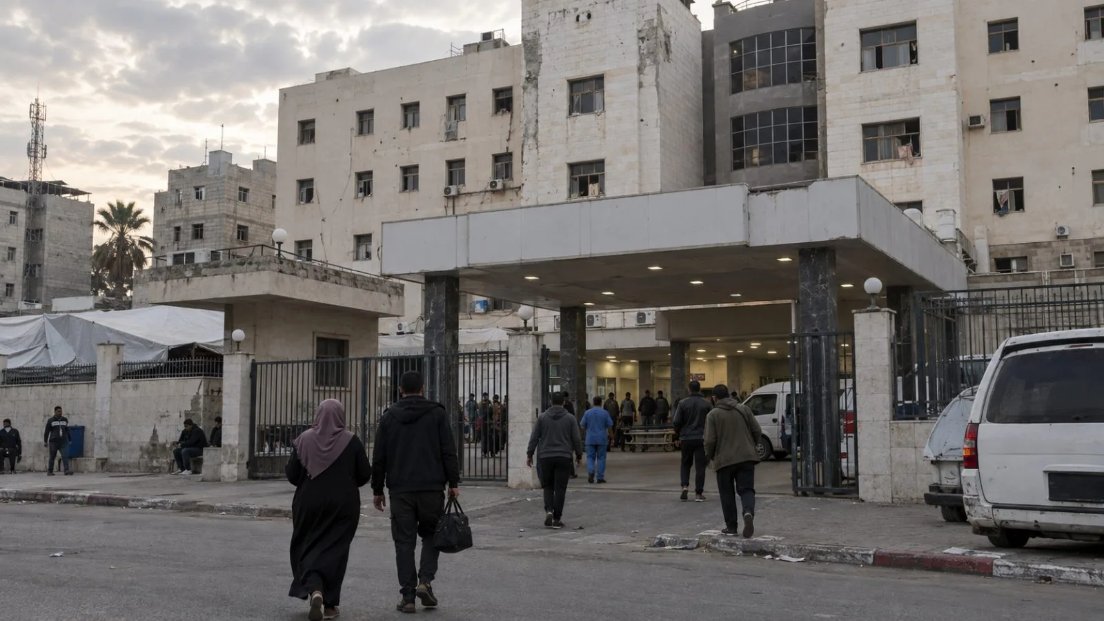 People arrive at Shifa Hospital in Gaza City under overcast skies. (AI-generated image / EconoTimes)