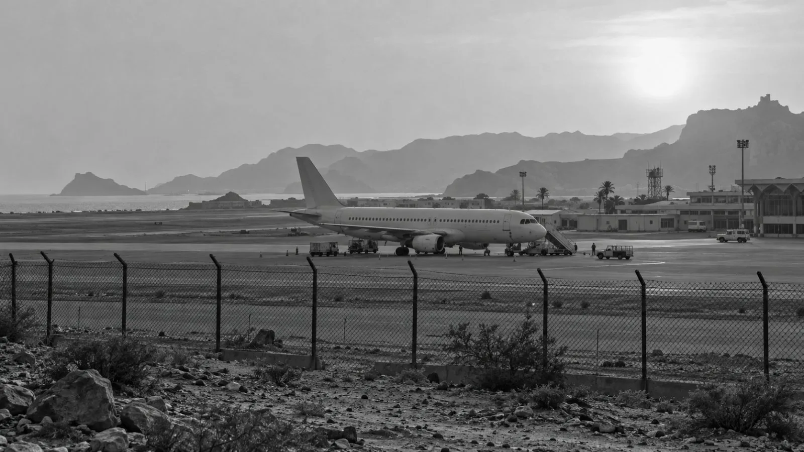 A passenger aircraft stands near the runway at Aden International Airport in Yemen. (AI-generated image / EconoTimes)