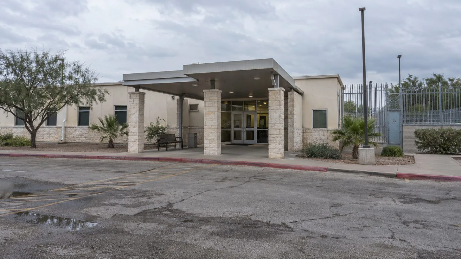 A youth shelter entrance in San Benito, Texas, sits beneath a gray afternoon sky. (AI-generated image / EconoTimes)