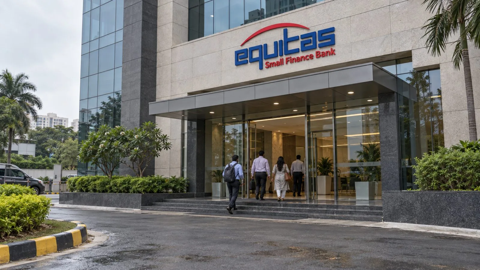 Staff members enter Equitas Small Finance Bank’s headquarters in Chennai, India, on an overcast morning. / EconoTimes.ai