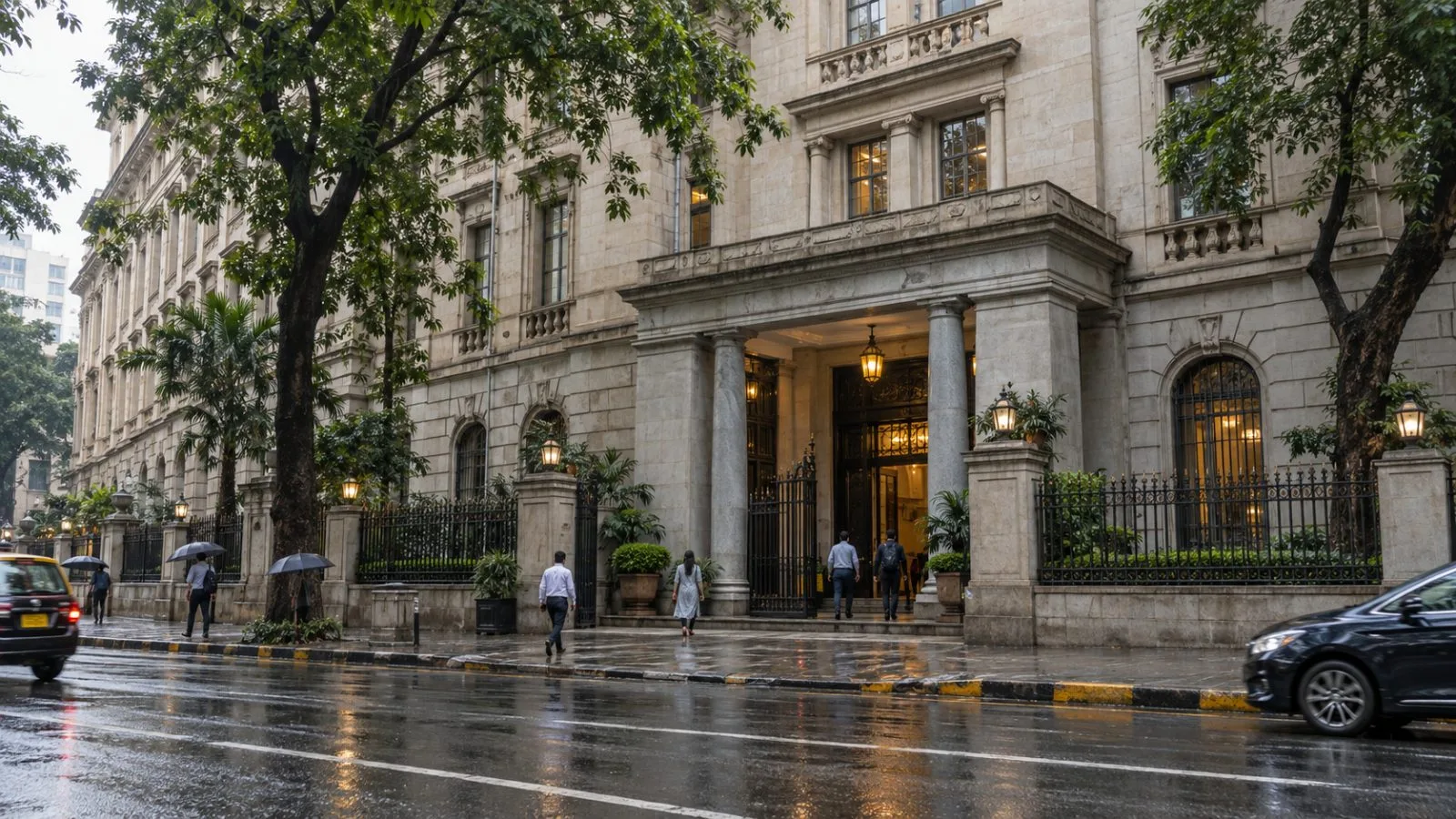 Office workers enter Bombay House in Mumbai under soft morning light. / EconoTimes.ai
