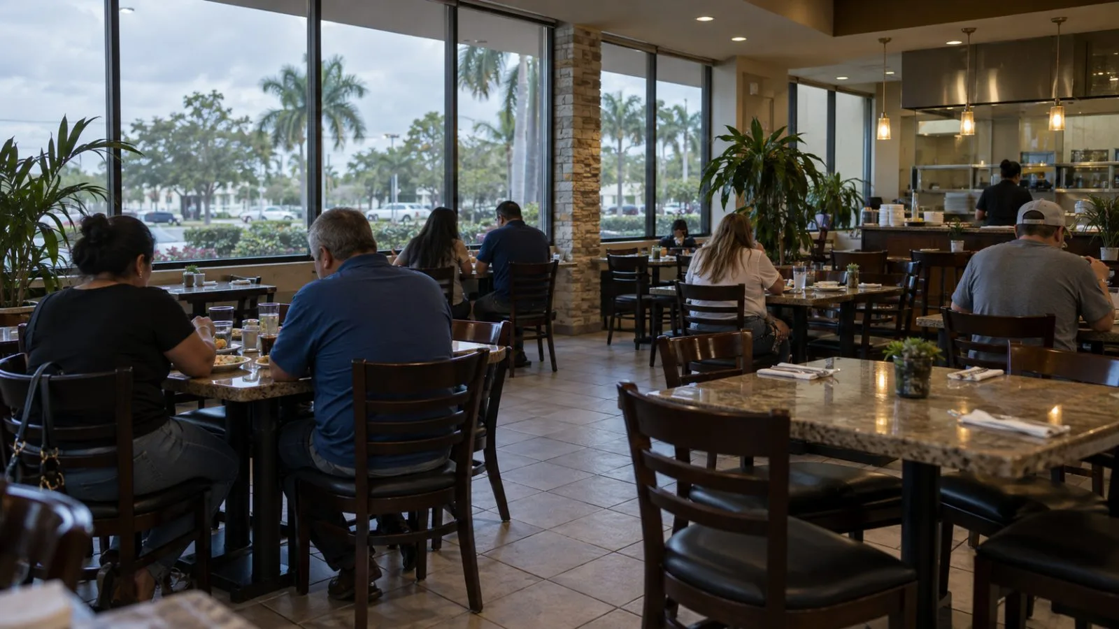 A few diners sit inside a restaurant in Doral, Florida, during late afternoon. (AI-generated image / EconoTimes)