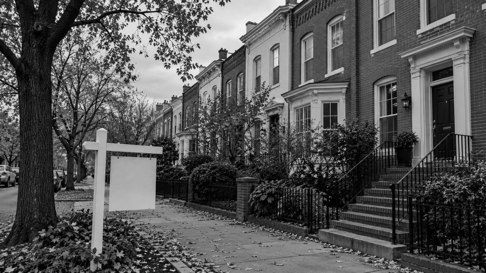 A rowhouse stands behind a real-estate sign on a residential street in Washington, D.C. (AI-generated image / EconoTimes)
