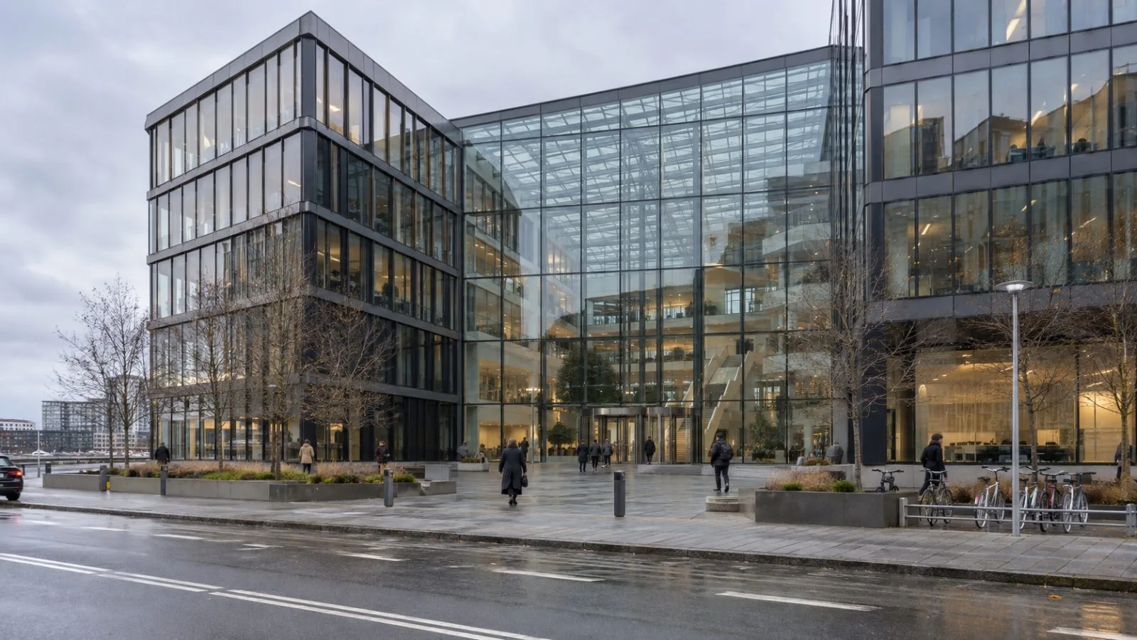 Pedestrians pass the Atrium office building on Havneholmen in Copenhagen. (AI-generated image / EconoTimes)