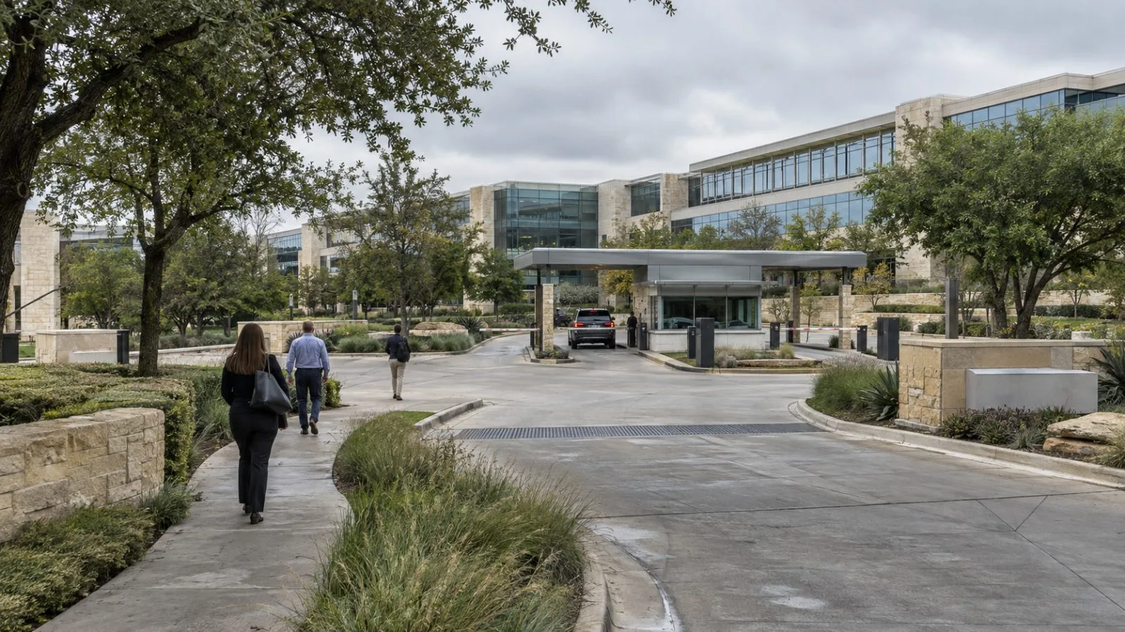 A person holds a smartphone outside Charles Schwab’s campus in Westlake, Texas / EconoTimes.ai