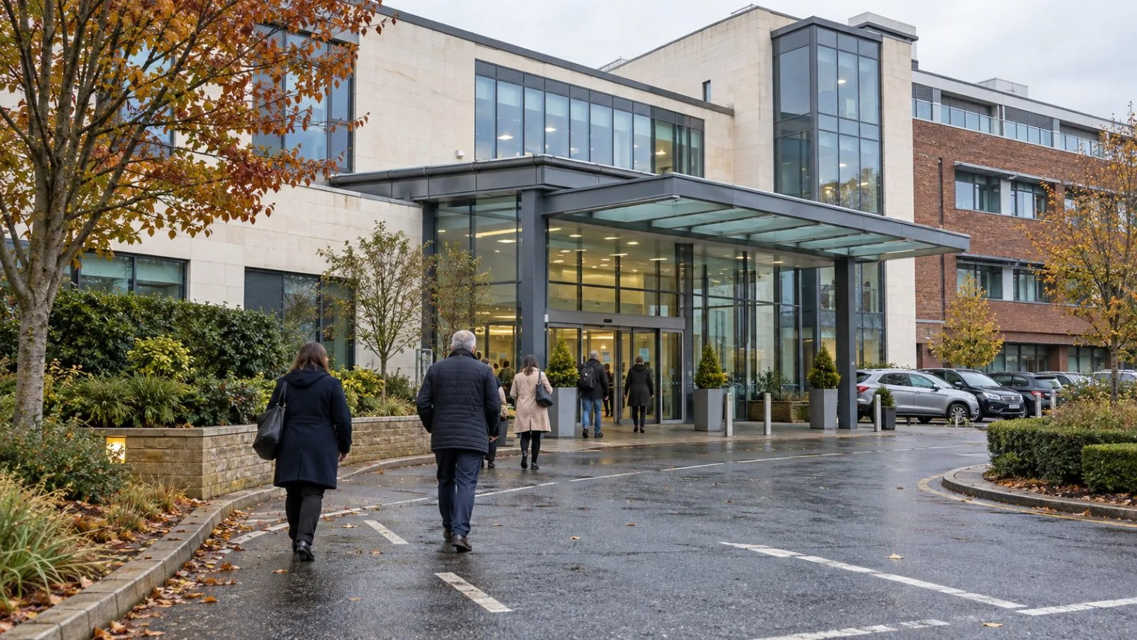 Visitors walk toward Nuffield Health Woking Hospital in Woking, Surrey. (AI-generated image / EconoTimes)