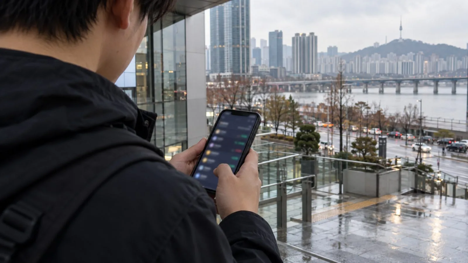 A person checks a phone near a window in Seoul, South Korea. (AI-generated image / EconoTimes)