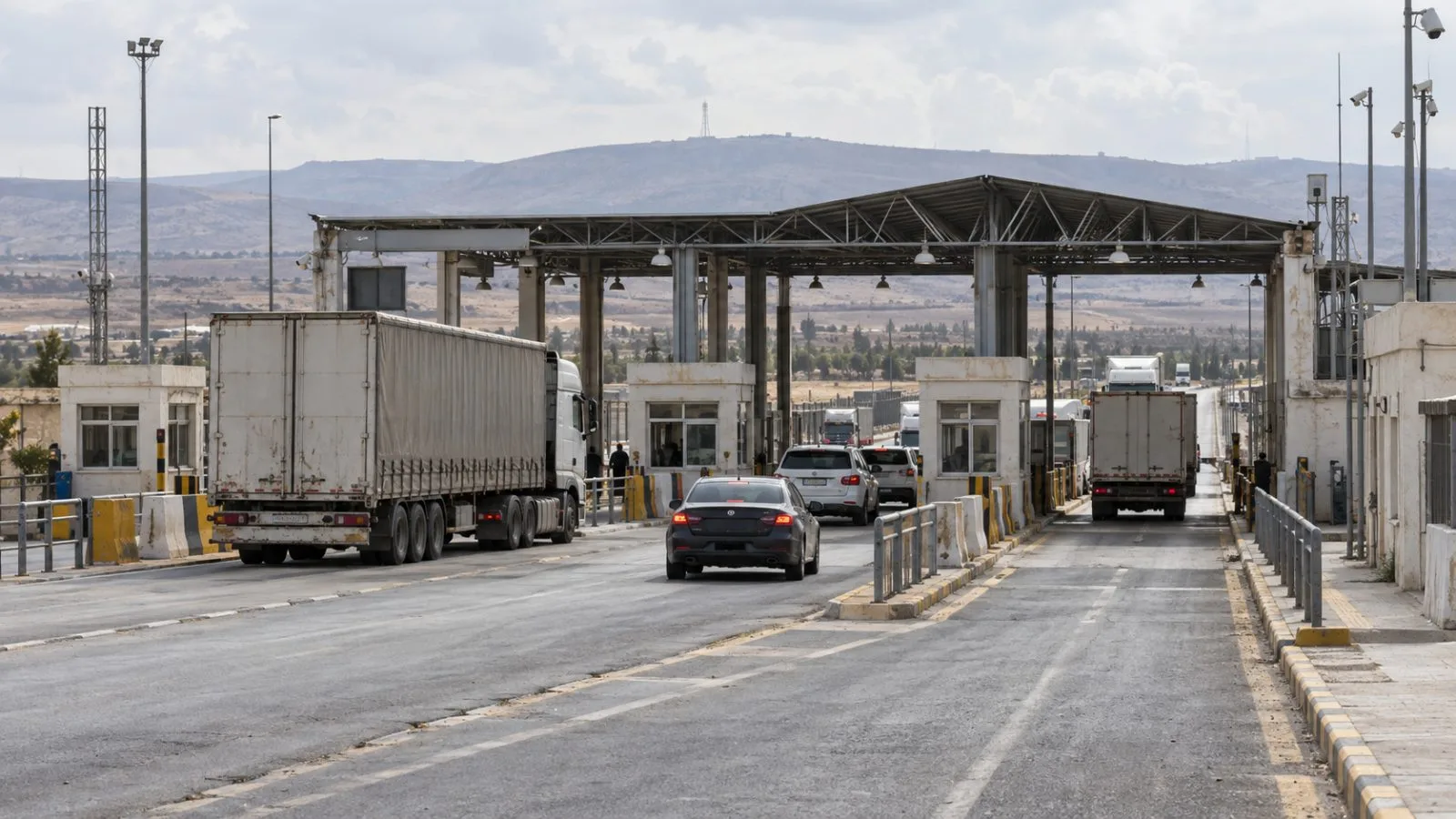 Trucks and passenger cars move through customs lanes at the Nassib crossing in Daraa, Syria (AI-generated image / EconoTimes)