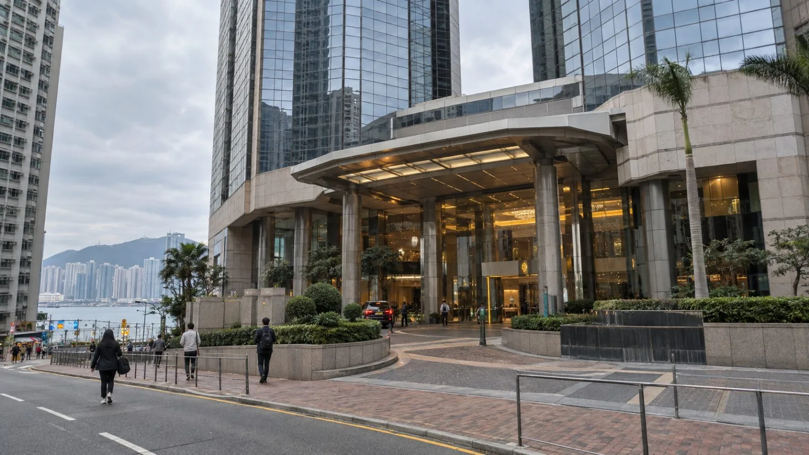Pedestrians pass Tower 2 of Harbour Centre in Hung Hom, Hong Kong. (AI-generated image / EconoTimes)
