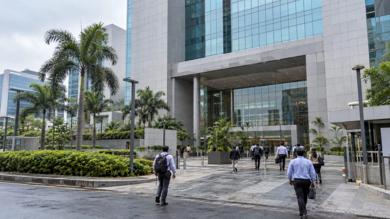 Commuters pass the National Stock Exchange building in Mumbai's Bandra Kurla Complex. (AI-generated image / EconoTimes)