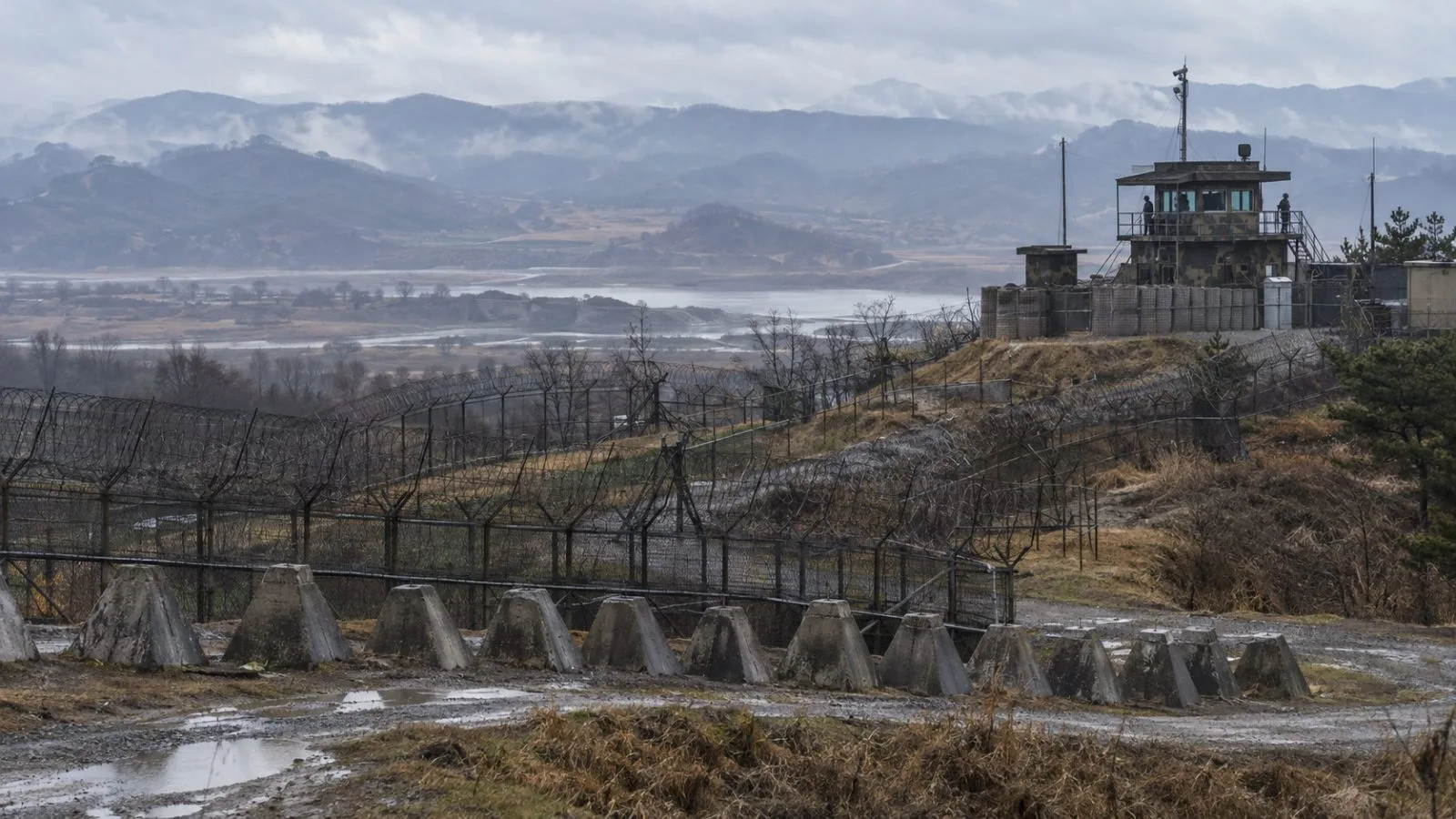 Barbed-wire fencing lines the southern edge of the Demilitarized Zone near Paju, South Korea. (AI-generated image / EconoTimes)