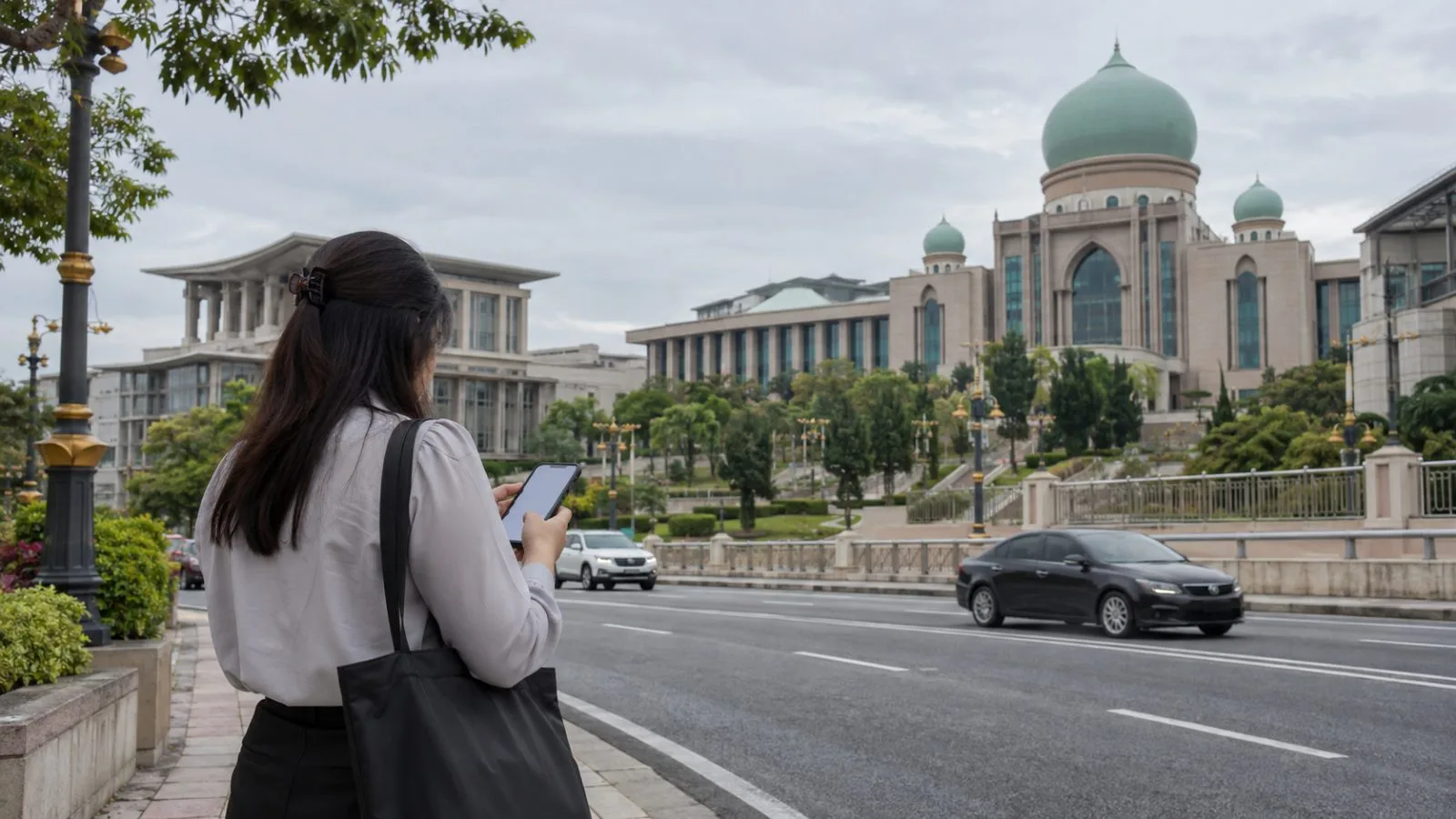 A smartphone and official circular sit on a counter at a Penang government office / EconoTimes.ai