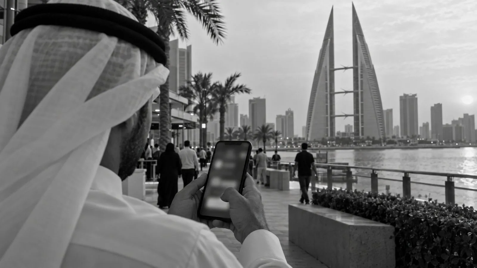 A hand uses a smartphone near Bahrain World Trade Center in Manama, Bahrain. (AI-generated image / EconoTimes)