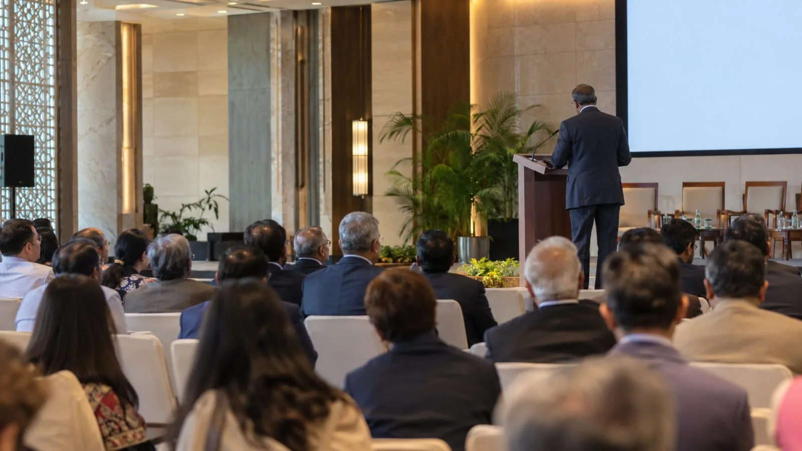 Delegates listen to a speaker at the NDTV World Summit in New Delhi, India. (AI-generated image / EconoTimes)
