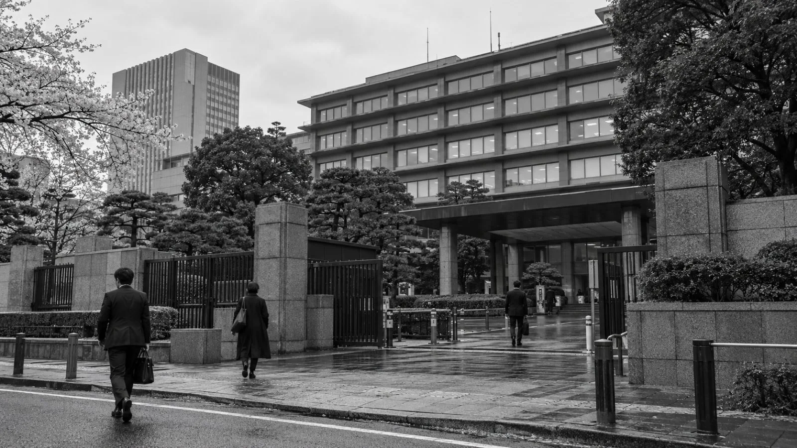 Pedestrians pass Japan’s Ministry of Foreign Affairs building in Tokyo on an overcast morning. (AI-generated image / EconoTimes)