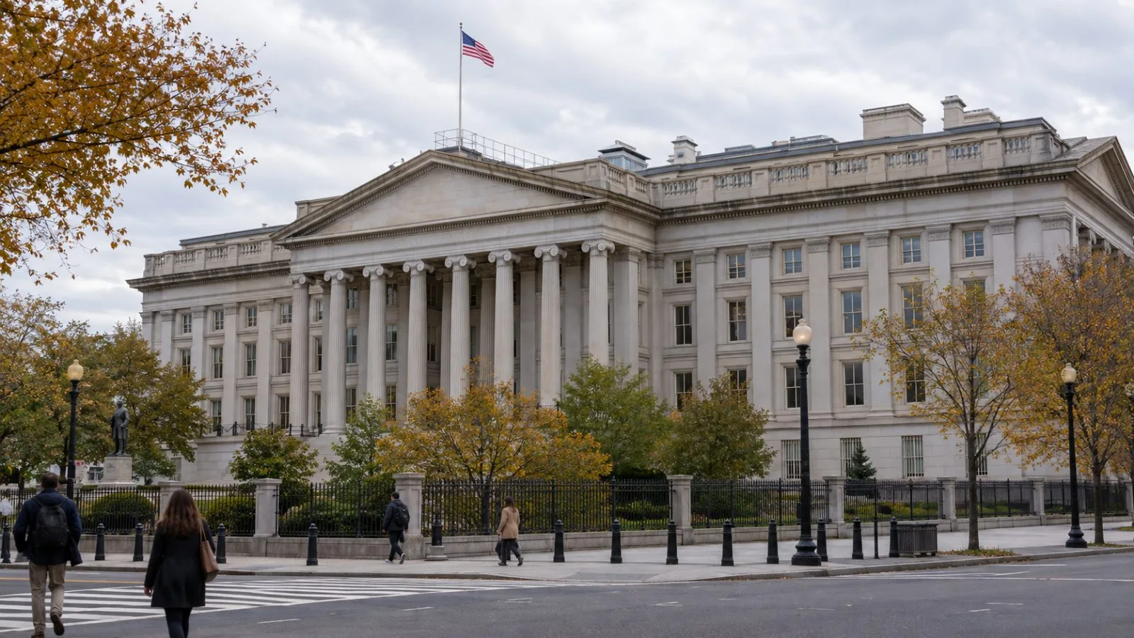 Pedestrians pass the U.S. Treasury building along Pennsylvania Avenue in Washington, D.C. / EconoTimes.ai