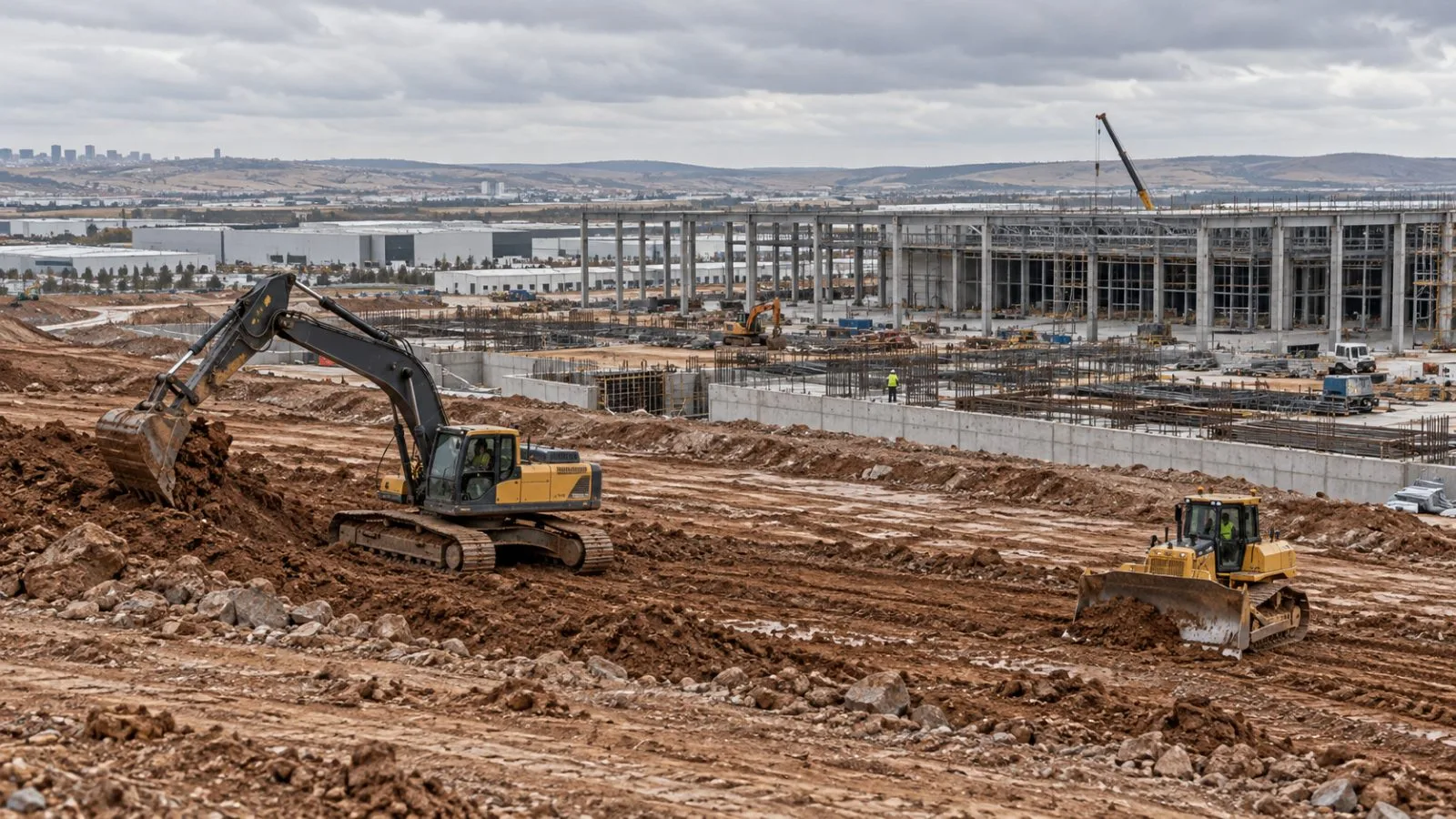 Earthmoving equipment stands on a cleared site in Ankara’s Başkent Organized Industrial Zone. (AI-generated image / EconoTimes)