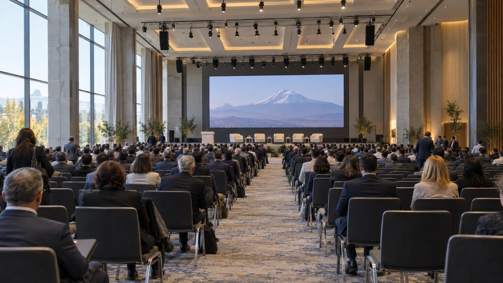 Delegates gather for a plenary session at Meridian Expo and Event Center in Yerevan. (AI-generated image / EconoTimes)