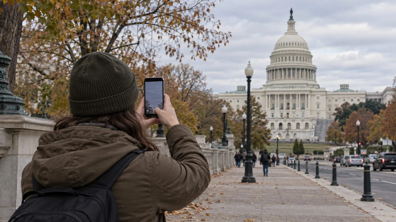A person records a smartphone video near the U.S. Capitol in Washington. (AI-generated image / EconoTimes)