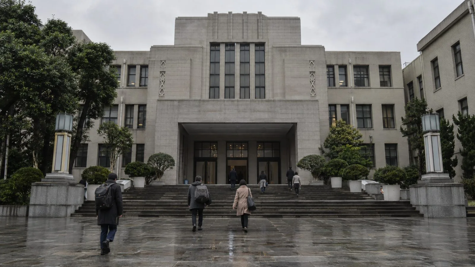 People walk toward the Legislative Yuan in Taipei on an overcast morning. (AI-generated image / EconoTimes)