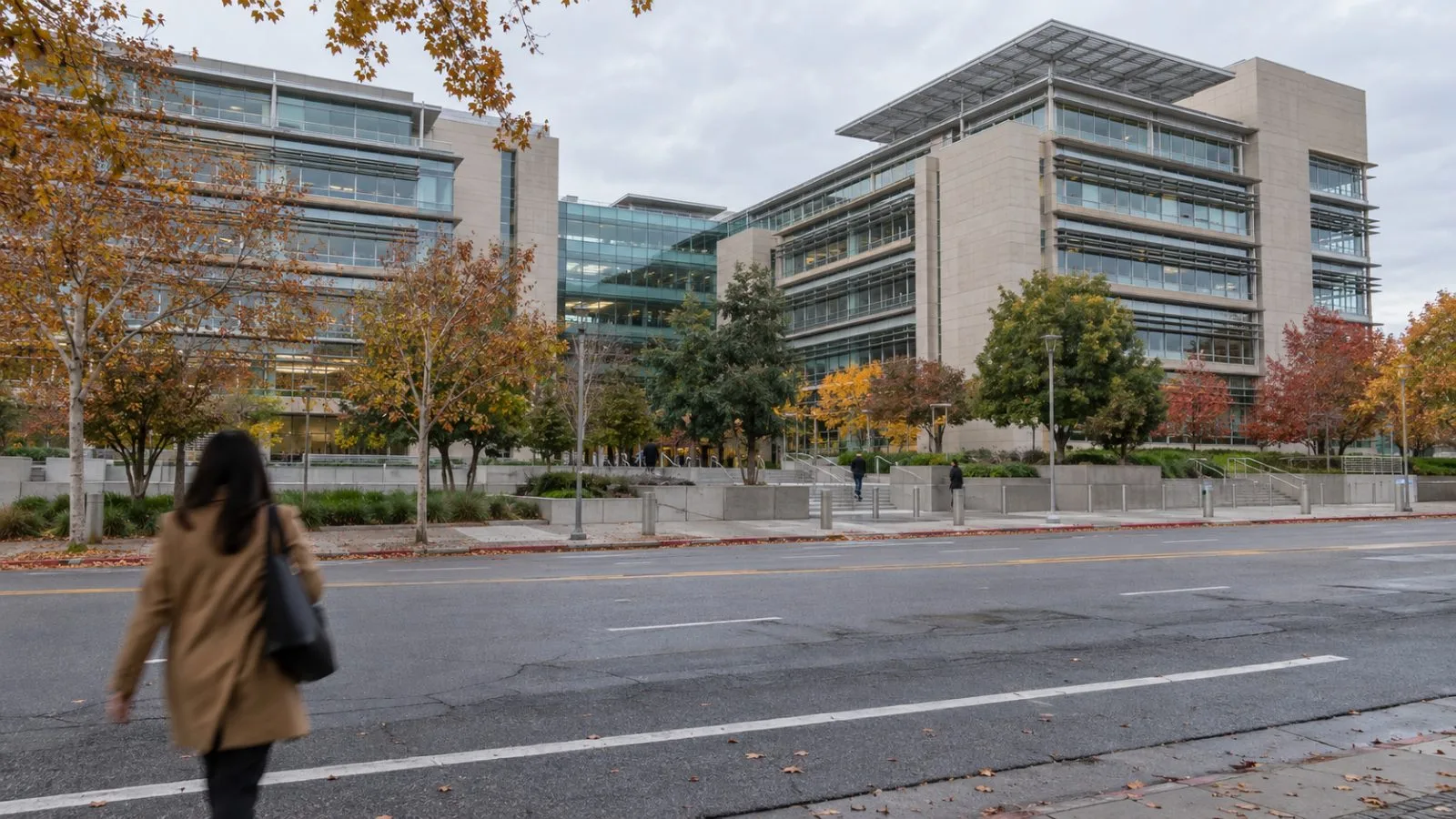 CalPERS headquarters stands beside Q Street in Sacramento, California, beneath a gray morning sky. (AI-generated image / EconoTimes)