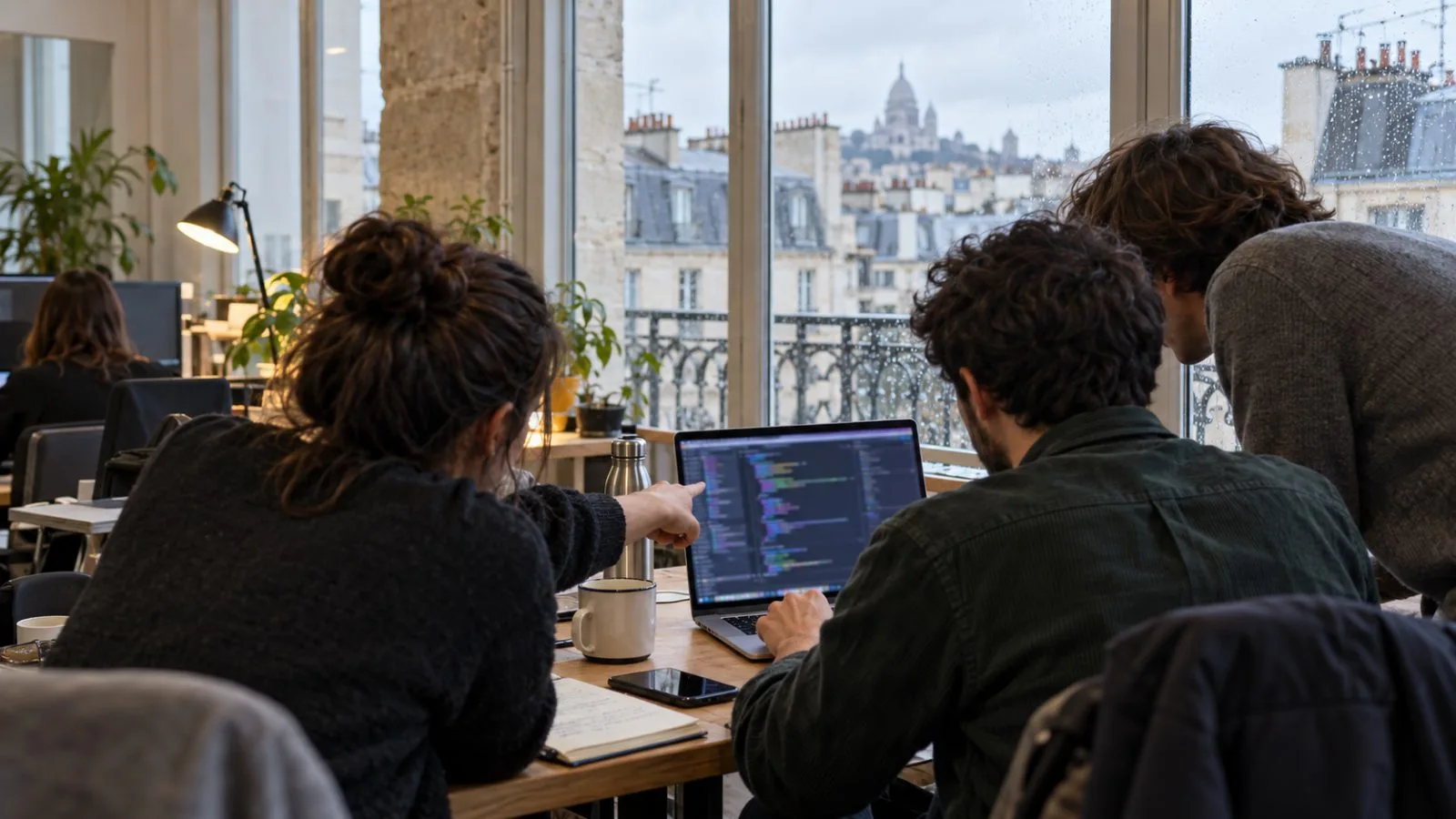Anonymous contributors review PHP code together in a shared workspace in Paris, France. (AI-generated image / EconoTimes)
