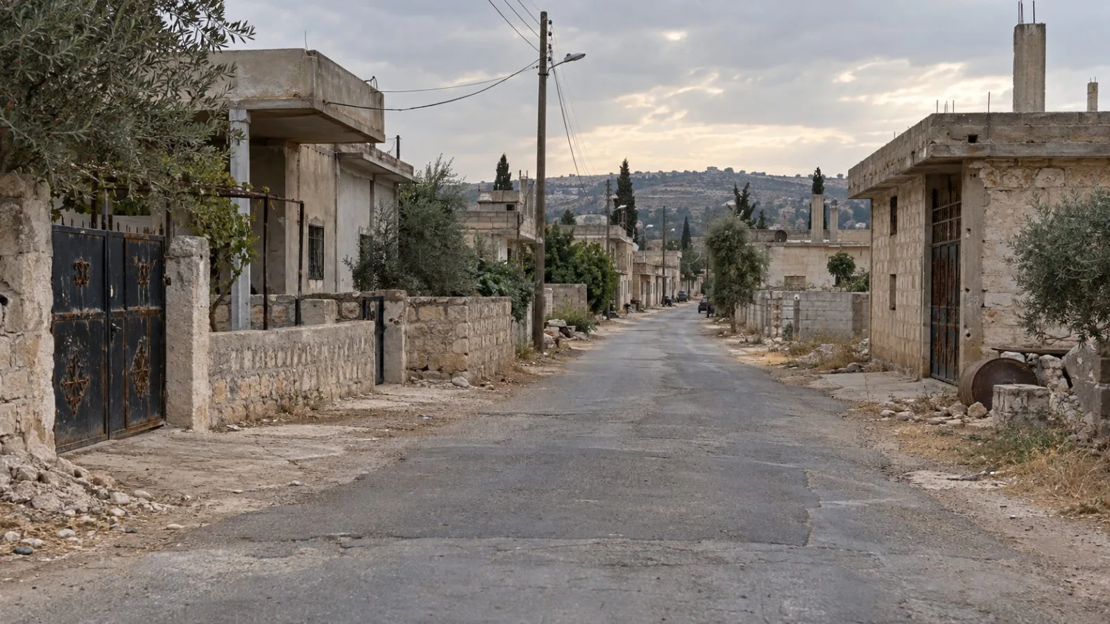 An empty village lane runs between homes in Jamla, Syria’s southern Daraa province. (AI-generated image / EconoTimes)