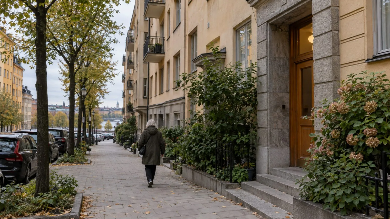 An older pedestrian walks past trees beside apartment buildings in Stockholm’s Kungsholmen district. (AI-generated image / EconoTimes)
