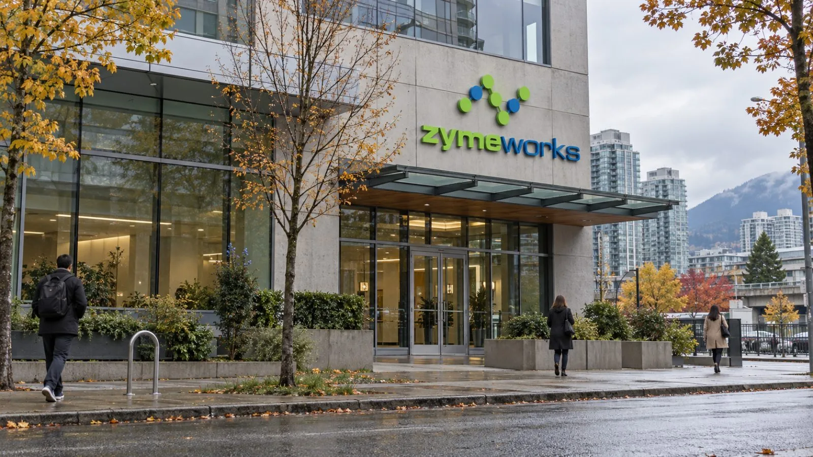 Pedestrians pass an office building on East Fourth Avenue in Vancouver, Canada. / EconoTimes.ai