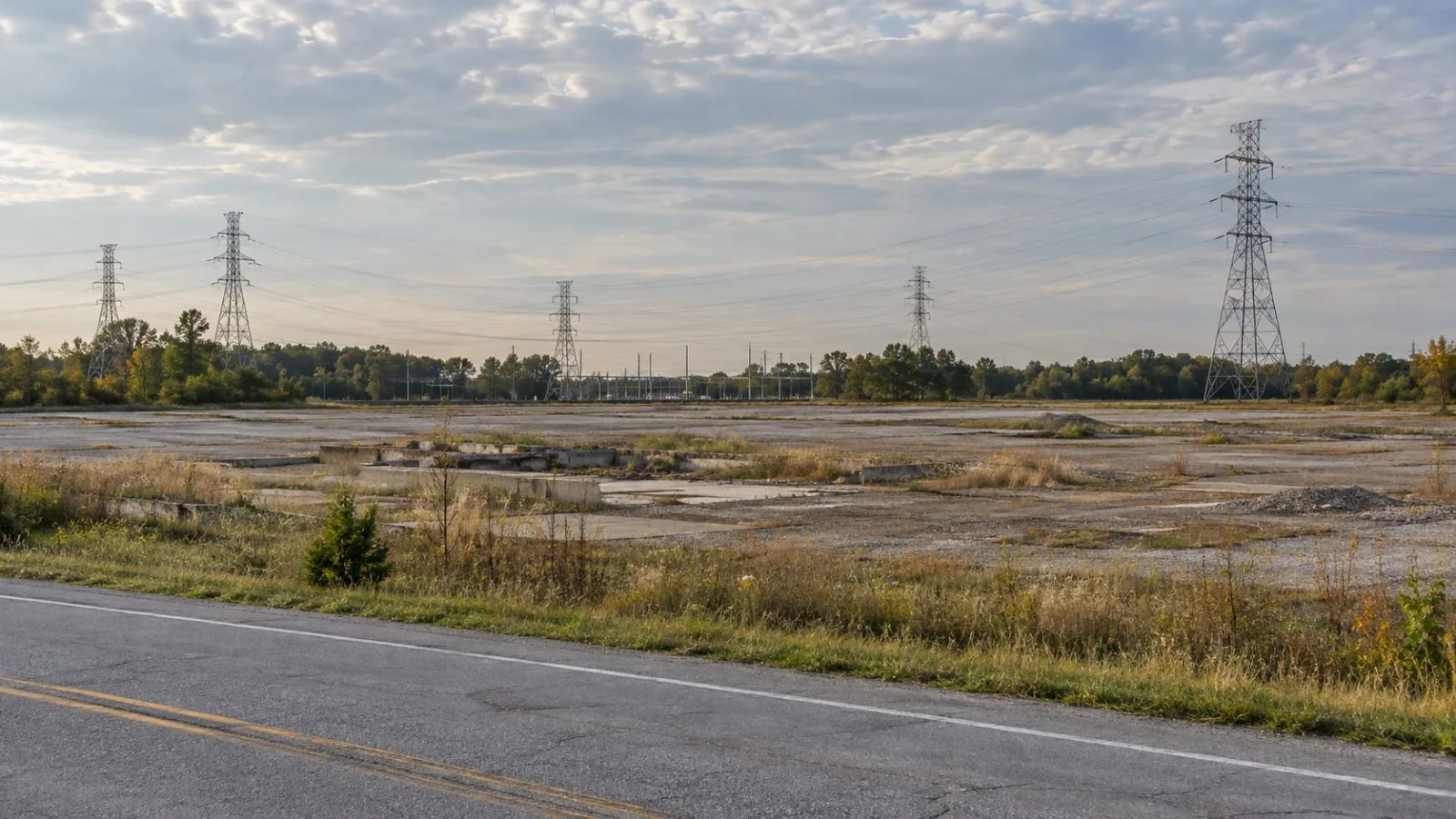 Transmission towers stand near the former Breed Generating Station site in Fairbanks, Indiana. (AI-generated image / EconoTimes)